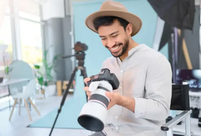 happy-photographer-man-with-camera-studio-smile-excited-before-photo-shoot-backstage-photography-asian-guy-relax-profession-shooting-design-creative-career