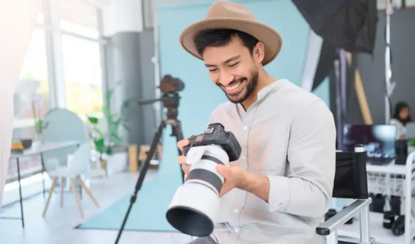 happy-photographer-man-with-camera-studio-smile-excited-before-photo-shoot-backstage-photography-asian-guy-relax-profession-shooting-design-creative-career