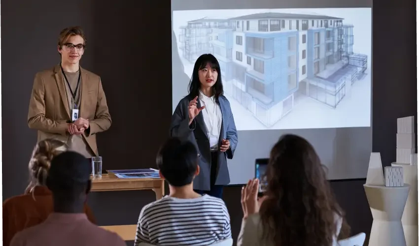 business-people-presenting-new-building-2025-02-11-15-31-23-utc